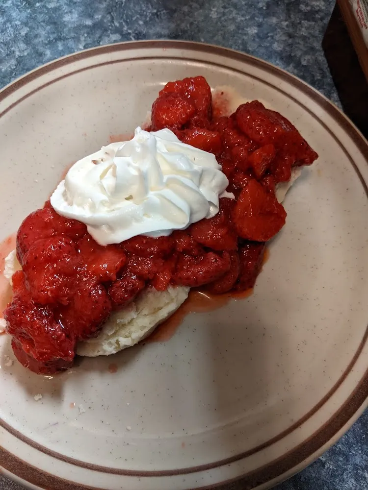 Cinnamon Roll Topped with Strawberries and Blueberries